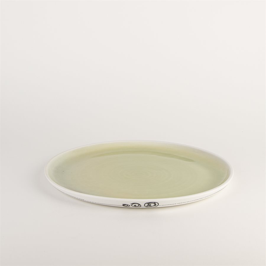 Porcelain dinner plate with green interior