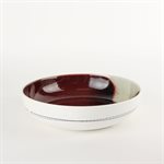 Porcelain pasta bowl with red and green interior