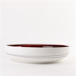 Large porcelain serving bowl with red interior