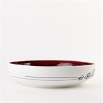 Large porcelain serving bowl with red interior