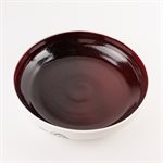 Large porcelain serving bowl with red interior