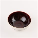 Small round porcelain bowl with red interior