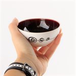 Small round porcelain bowl with red interior
