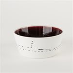 Small flared ceramic bowl with red interior