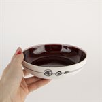 Small porcelain pasta bowl with red interior