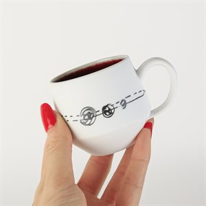Miniature porcelain cup with red interior
