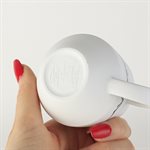 Miniature porcelain cup with red interior