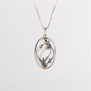 Silver pendant adorned with gold, openwork foliage model 